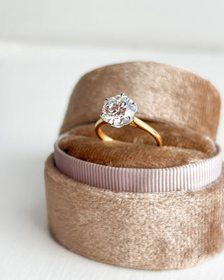 Diamond Engagement Rings with Oval Centre and Pear Side Stones in platinum and yellow gold