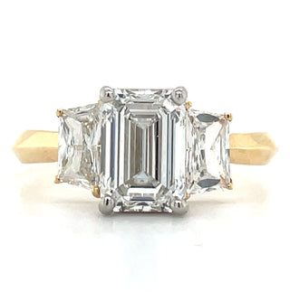 yellow gold emerald cut diamond engagement ring with tapered baguette side stones