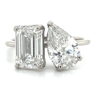 platinum emerald and pear cut diamond engagement ring toi et moi style