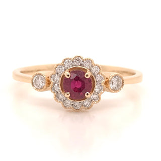 Ruby and diamond halo with two side stones