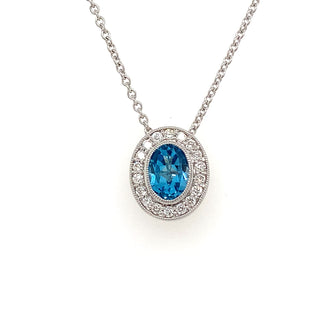 9ct White Gold 0.96ct Blue Topaz & Diamond Halo Pendant