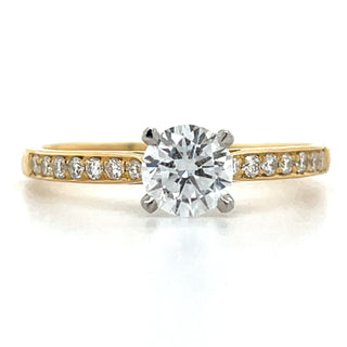 Round brilliant Solitaire Engagement ring with stone set shoulders 