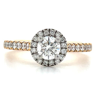 rose gold engagement ring with round brilliant diamond halo and diamond set shoulders