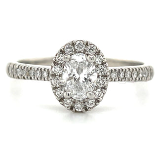 platinum oval halo diamond engagement ring with castel set shoulders