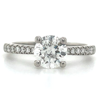 platinum round solitaire diamond engagement ring with stone set shoulders