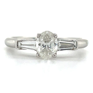 platinum oval diamond engagement ring with tapered baguette side stones