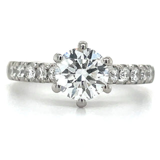 platinum round diamond solitaire engagement ring with diamond set shoulders