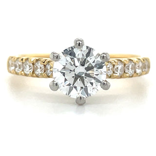 yellow gold round diamond solitaire engagement ring with diamond set shoulders