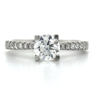 platinum round solitaire diamond engagement ring with diamond set shoulders