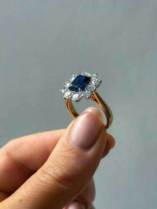 9ct Yellow Gold Laboratory Grown 2.20ct Emerald Cut Sapphire And 1.70ct Diamond Halo Ring
