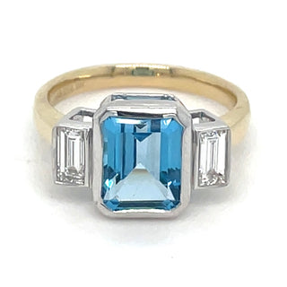 9ct Yellow Gold Laboratory Grown 4.29ct Emerald Cut Topaz And 0.44ct Side Baguette Diamond Ring