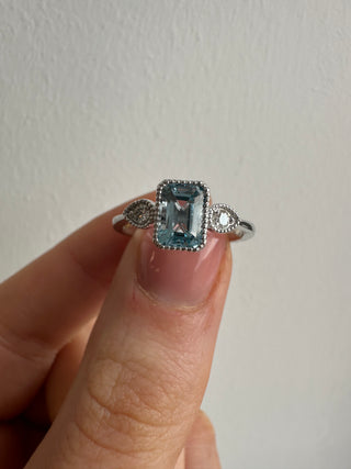 9ct White Gold Milgrain Edge Earth Grown 1.21ct Blue Topaz & 0.10ct Diamond Ring