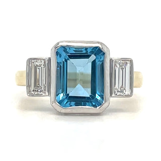 9ct Yellow Gold Laboratory Grown 4.29ct Emerald Cut Topaz And 0.44ct Side Baguette Diamond Ring