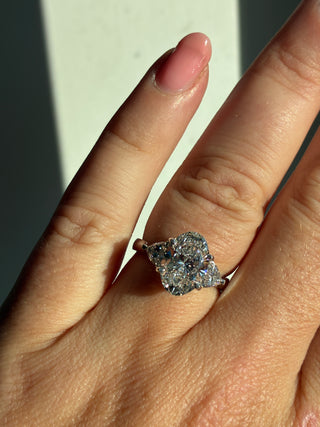 Flossie - Platinum Laboratory Grown 3.17ct Oval Diamond With Trillion Side Stone Engagement Ring