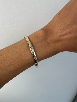 9ct Yellow Gold Gypsy Set Laboratory Grown Oval Cut 1.10ct Diamond Bangle