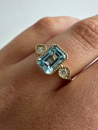 9ct Yellow Gold Milgrain Edge Earth Grown 1.26ct Blue Topaz & 0.10ct Diamond Ring