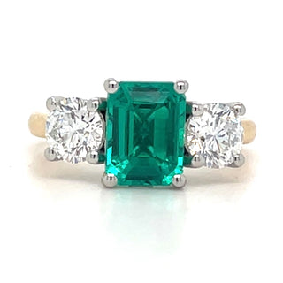 18ct Yellow Gold Laboratory Grown 2.50ct Radiant Cut Emerald and Round Brilliant Three Stone Diamond Ring