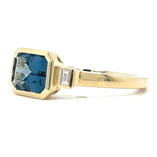 9ct Yellow Gold Earth Grown Horizontal Emerald Cut Blue Topaz And Diamond Ring