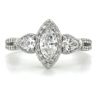 platinum marquise halo diamond engagement ring with pear halo side stones and a split band set with diamonds