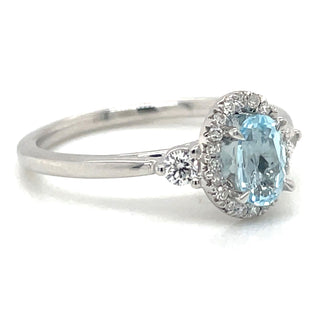 9ct White Gold Earth Grown Oval Sky Blue Topaz & Diamond Halo Ring