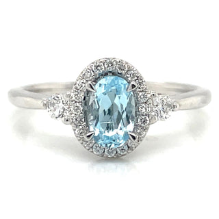 9ct White Gold Earth Grown Oval Sky Blue Topaz & Diamond Halo Ring