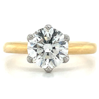 18ct gold engagement ring with round solitaire set in platinum six claws