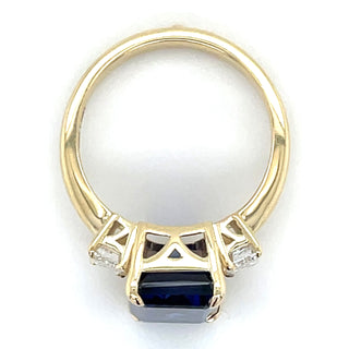 14ct Yellow Gold Laboratory Grown Emerald cut 7.35ct Sapphire with Two Laboratory grown Diamond Side Stone Ring
