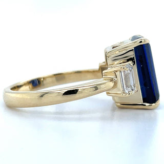 14ct Yellow Gold Laboratory Grown Emerald cut 7.35ct Sapphire with Two Laboratory grown Diamond Side Stone Ring