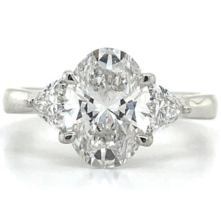 Flossie - Platinum Laboratory Grown 2.47ct Oval Diamond With Trillion Side Stone Engagement Ring
