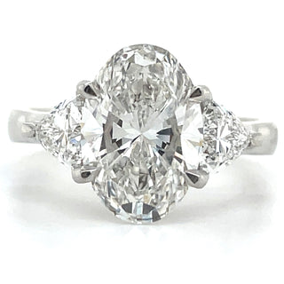 Flossie - Platinum Laboratory Grown 3.71ct Oval Diamond With Trillion Side Stone Engagement Ring