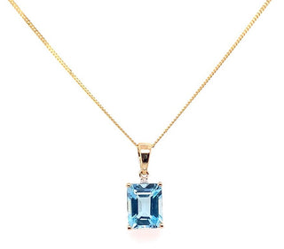 9ct Yellow Gold Earth Grown Blue Topaz And Diamond Pendant.