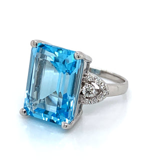 9ct White Gold 14ct Blue Topaz with 0.35ct Diamond Side Accent Ring