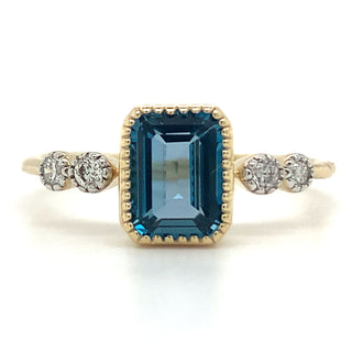9ct Yellow Gold 1.34ct Emerald Cut London Blue Topaz Ring with Side Diamonds