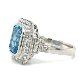 9ct White Gold 4.18ct Emerald Cut Blue Topaz and Diamond Pave Set Halo