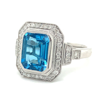 9ct White Gold 4.18ct Emerald Cut Blue Topaz and Diamond Pave Set Halo