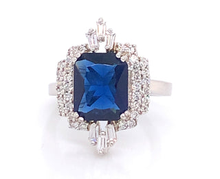 Sterling Silver Emerald Cut Sapphire And Cz Halo Ring
