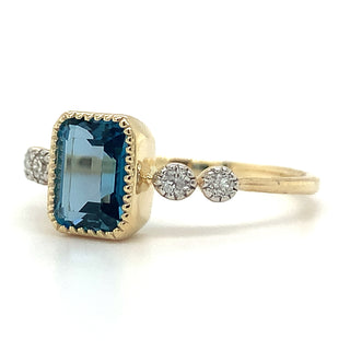 9ct Yellow Gold 1.34ct Emerald Cut London Blue Topaz Ring with Side Diamonds