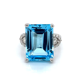 9ct White Gold 14ct Blue Topaz with 0.35ct Diamond Side Accent Ring