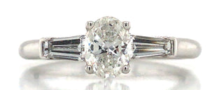 Platinum GIA Oval Diamond Ring with Baguette Side Stones